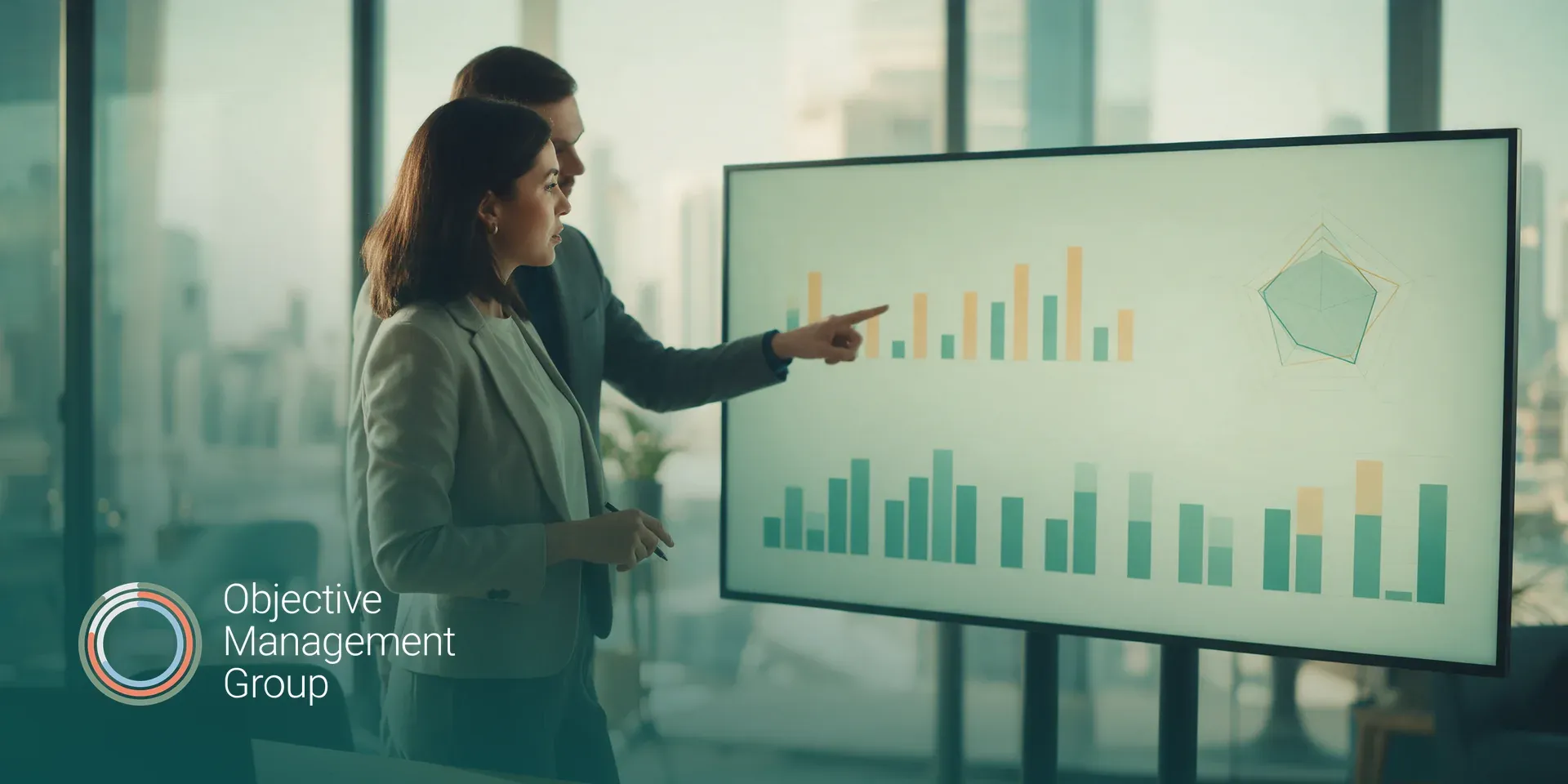 Objective Management Group logo over a sales leader reviewing assessment results